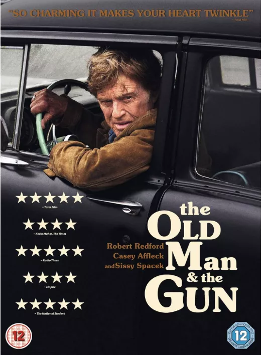 Filmplakat von „The Old Man & the Gun“ mit Robert Redford am Steuer eines Autos.