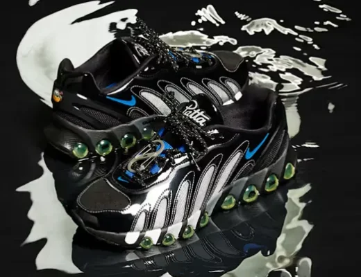 Paar des Patta x Nike Air Max DN8 auf schwarzer, spiegelnder Oberfläche mit Metallic-Panels und grünen Air-Kapseln.