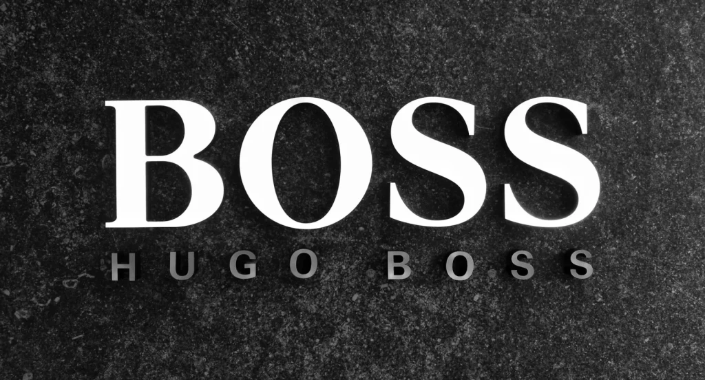 Hugo Boss Logo auf dunklem Hintergrund – Frasers Group übernimmt Mehrheit am deutschen Modekonzern